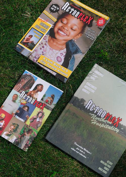 Three of the Retroflex volumes laid out on green grass:  The covers feature the Retroflex branding by Flex Dame a displaying the eclectic cover art of each issue.